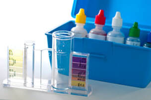 Chemical analysis kit with case for holding chemicals and sample tubes.