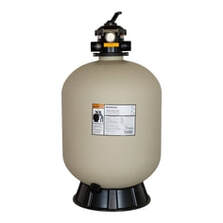 Picture of a pool sand filter with pressure gage on top.